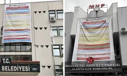 CHP'nin belediye binasına astığı borç afişine MHP'den alacak afişli cevap